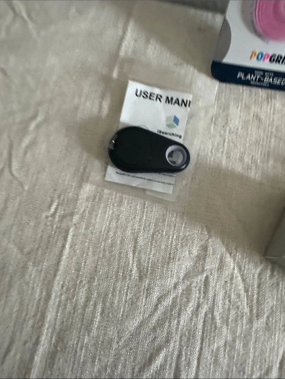 Pink PopSockets for phone, keychain & holder for air tags, a black tracking fob